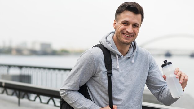 Portrait of positive male smiling