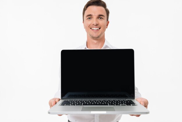 Portrait of a positive smiling man in white shirt