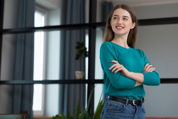 Portrait of positive young female looking away