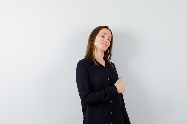 Portrait of pretty lady showing thumbs up