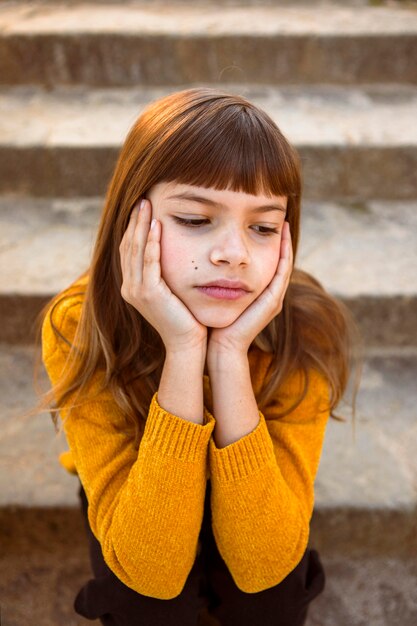 Portrait of pretty little girl being bored