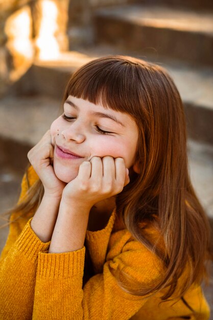 Portrait of pretty little girl being bored