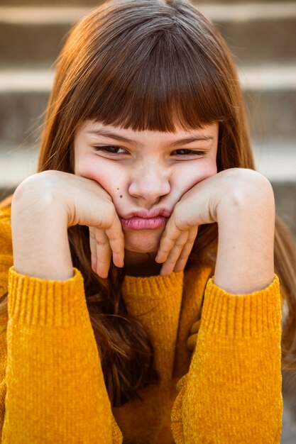 Portrait of pretty little girl being bored