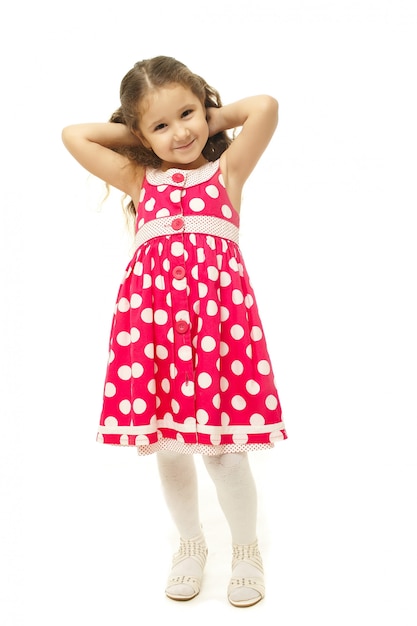 Portrait of a pretty little girl in pink dress 