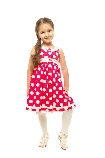 Free photo portrait of a pretty little girl in pink dress