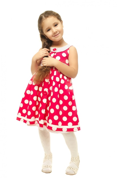 Portrait of a pretty little girl in pink dress 