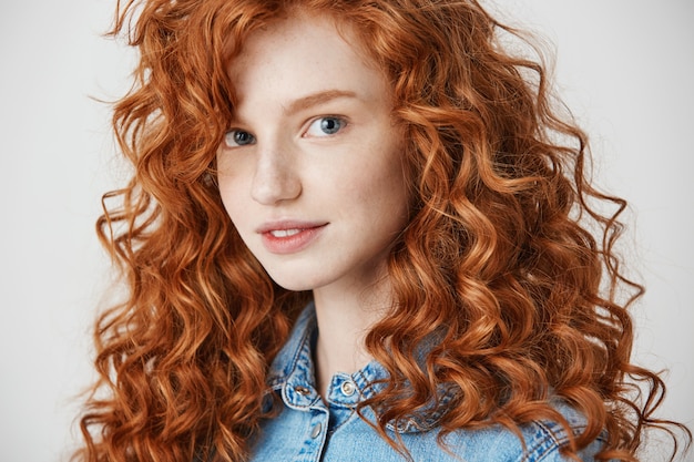 Free photo portrait of pretty redhead girl smiling .