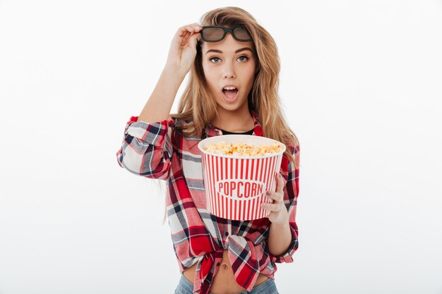 Portrait of a pretty shocked girl in plaid shirt