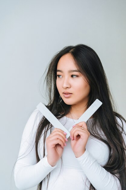 Portrait of a pretty smiling woman posing isolated