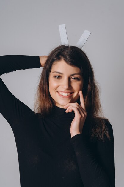 Portrait of a pretty smiling woman posing isolated