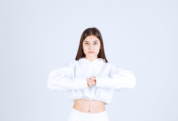 Portrait of pretty young girl model posing and looking forward.