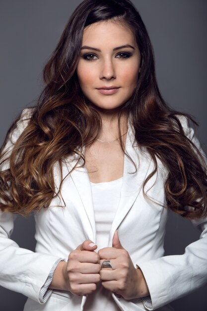 Portrait of pretty young woman posing in the studio photo.