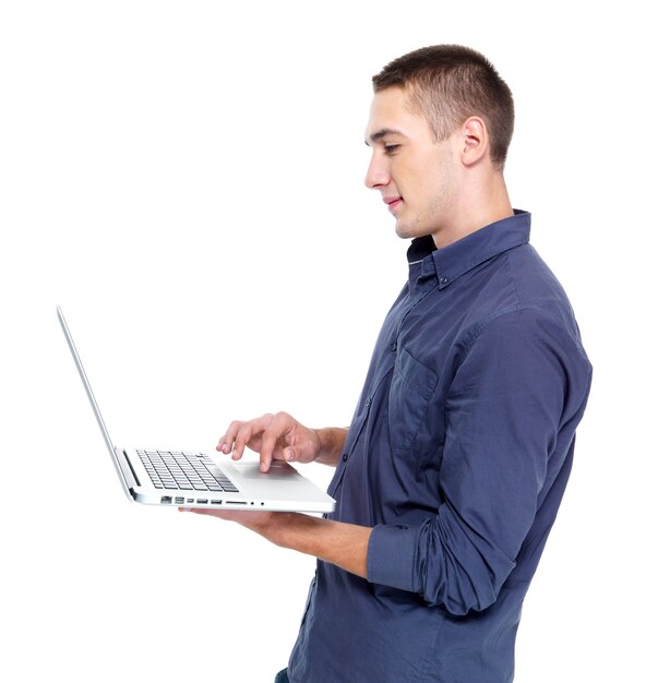 Portrait profile of happy young man with laptop isolated on white