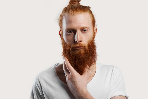 Portrait of red-haired man with perfect skin with fleckles