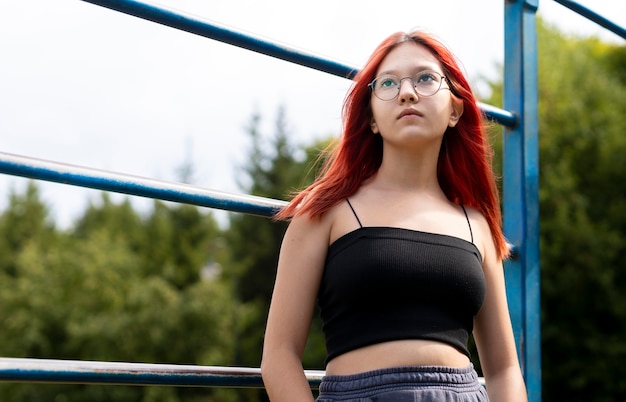 Portrait of redhead girl outdoors