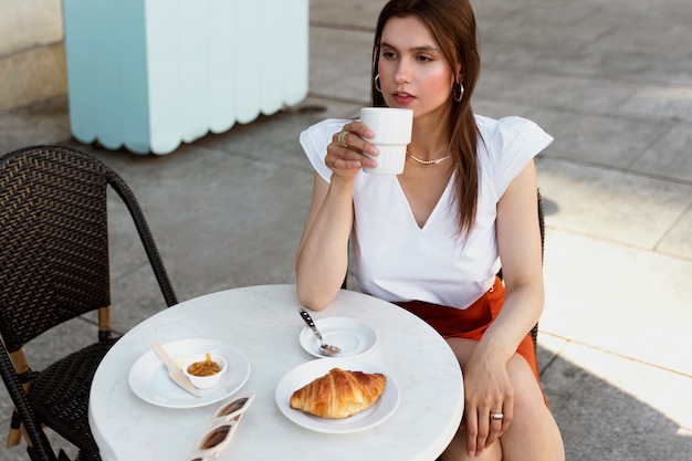 Portrait of rich woman having a coffee break