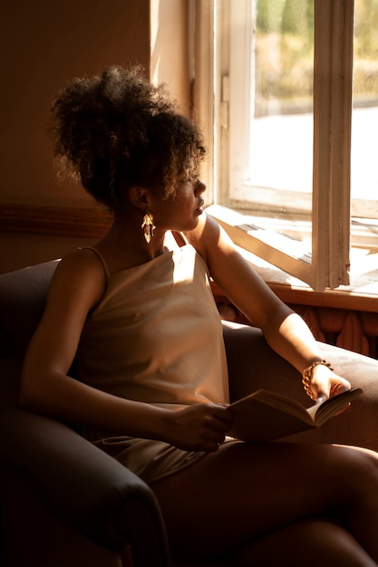 Portrait of rich woman reading indoors