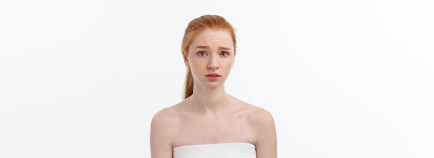 Free photo portrait sad serious young woman with disappointed facial expression isolated on white background lo