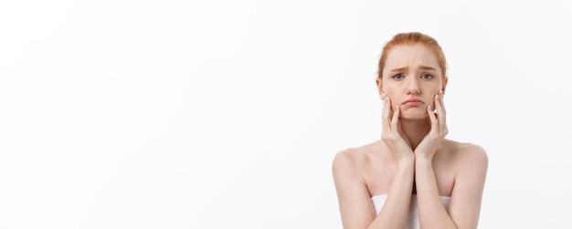 Free photo portrait sad serious young woman with disappointed facial expression isolated on white background lo