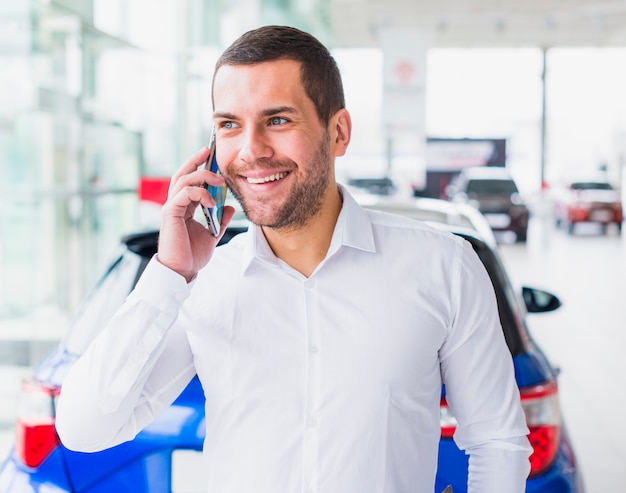 Portrait of salesman in car dealership