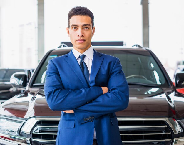 Portrait of salesman in car dealership