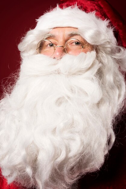 Portrait of Santa Claus on red background