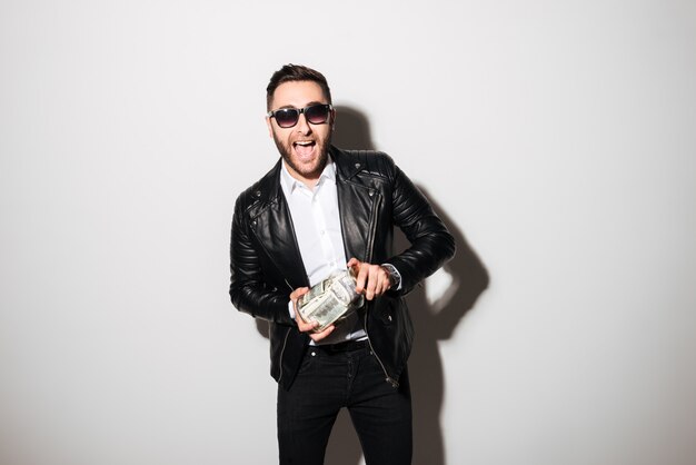 Portrait of a satisfied confident man in sunglasses