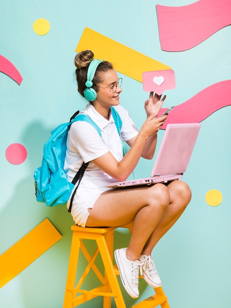 Portrait of schoolgirl on a memphis background