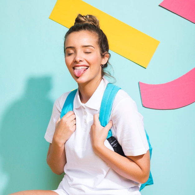 Portrait of schoolgirl on a memphis background