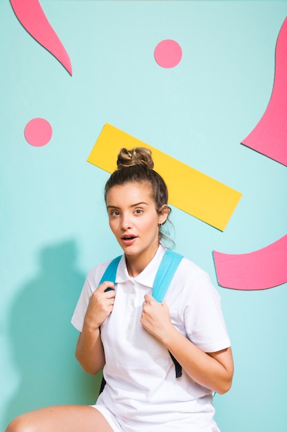 Free photo portrait of schoolgirl on a memphis background