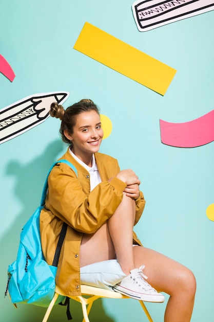 Free photo portrait of schoolgirl on a memphis background