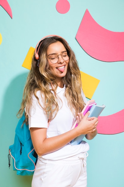 Portrait of schoolgirl on memphis style background