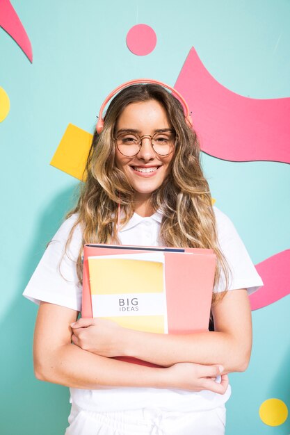 Portrait of schoolgirl on memphis style background