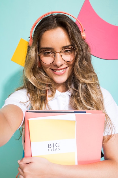 Portrait of schoolgirl on memphis style background