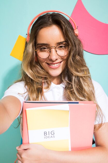 Portrait of schoolgirl on memphis style background