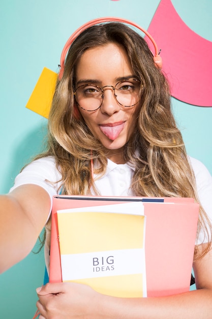 Portrait of schoolgirl on memphis style background