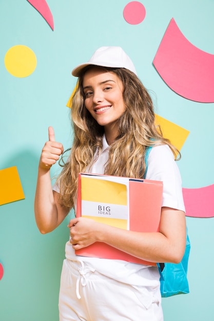 Portrait of schoolgirl on memphis style background