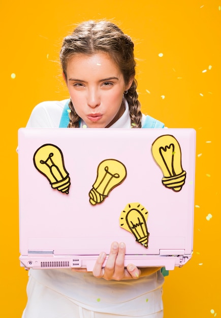 Free photo portrait of schoolgirl studying with laptop