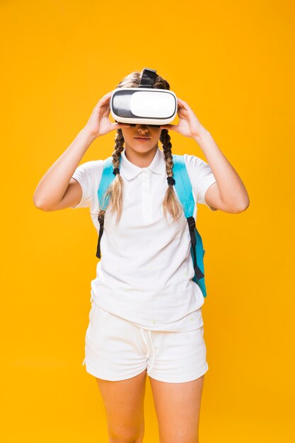 Portrait of schoolgirl with vr glasses