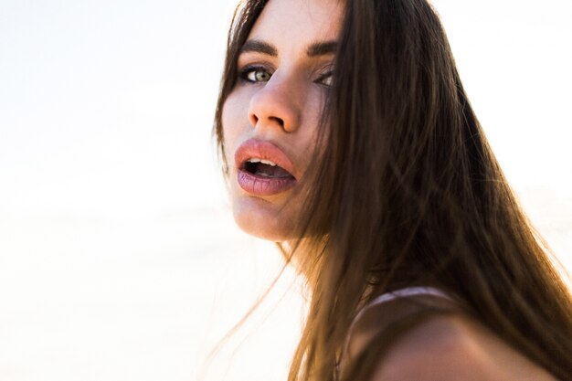 Portrait of seductive young woman with long hair