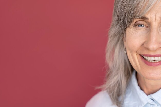 Portrait of senior gray-haired smiley woman