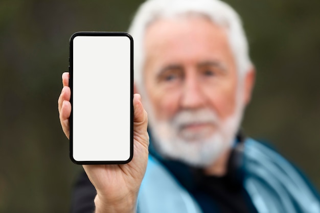 Portrait senior man jogging on mountain