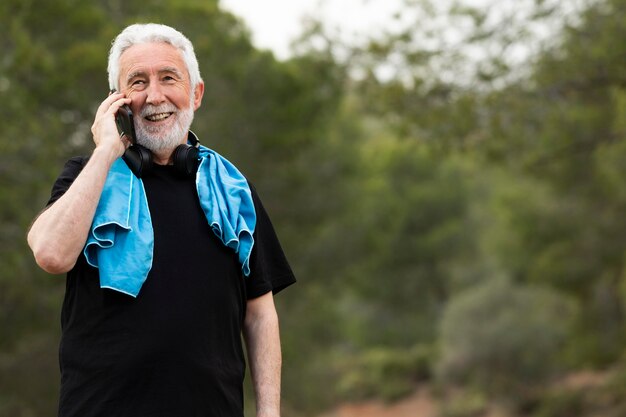 Portrait senior man jogging on mountain