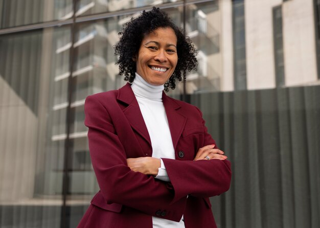 Portrait of senior woman in professional blazer outdoors