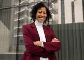 Free photo portrait of senior woman in professional blazer outdoors