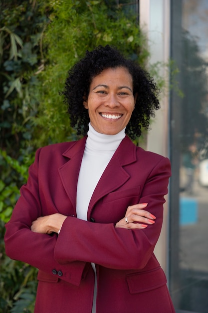 Portrait of senior woman in professional blazer outdoors