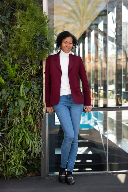 Portrait of senior woman in professional blazer outdoors