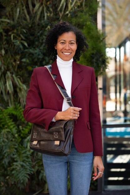Portrait of senior woman in professional blazer outdoors