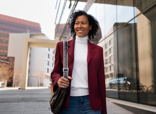 Portrait of senior woman in professional blazer outdoors