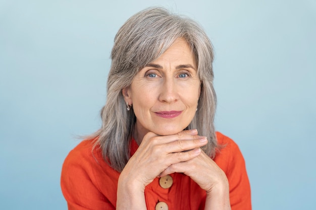 Free photo portrait of senior woman wearing red shirt